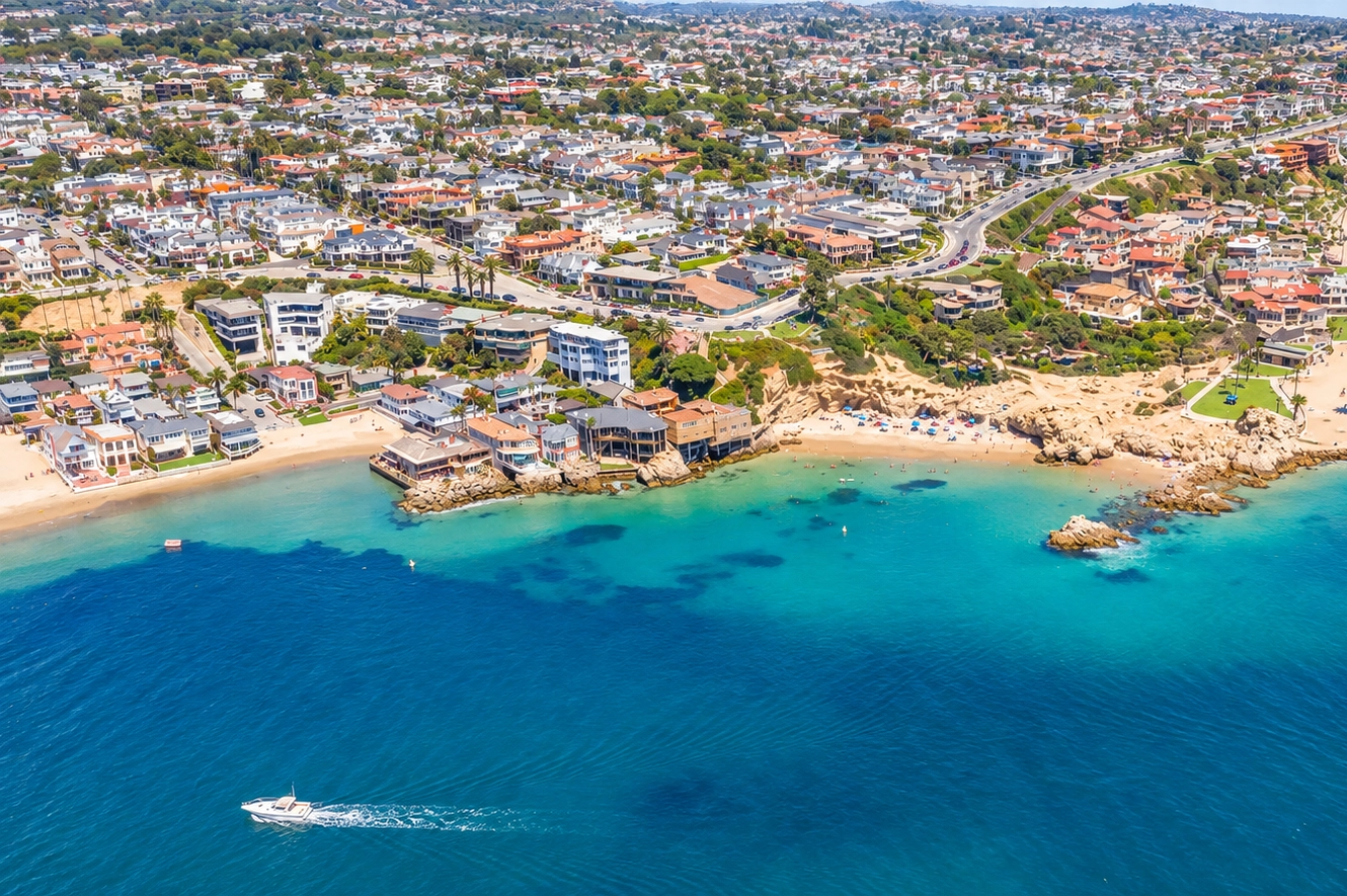 Palm-lined coastal street in Corona del Mar representing the 2026 rental market